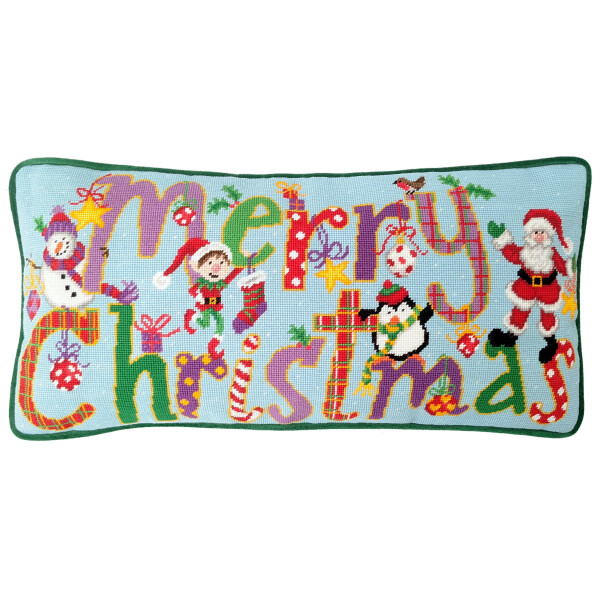Festive rectangular cushion with colorful, cross-stitched text Merry Christmas. Surrounding the text are images of a snowman, elf, gingerbread man, penguin, Santa and Christmas decorations on a light blue background with a dark green border. A perfect embroidery pack from Bothy Threads for your Christmas decorations.