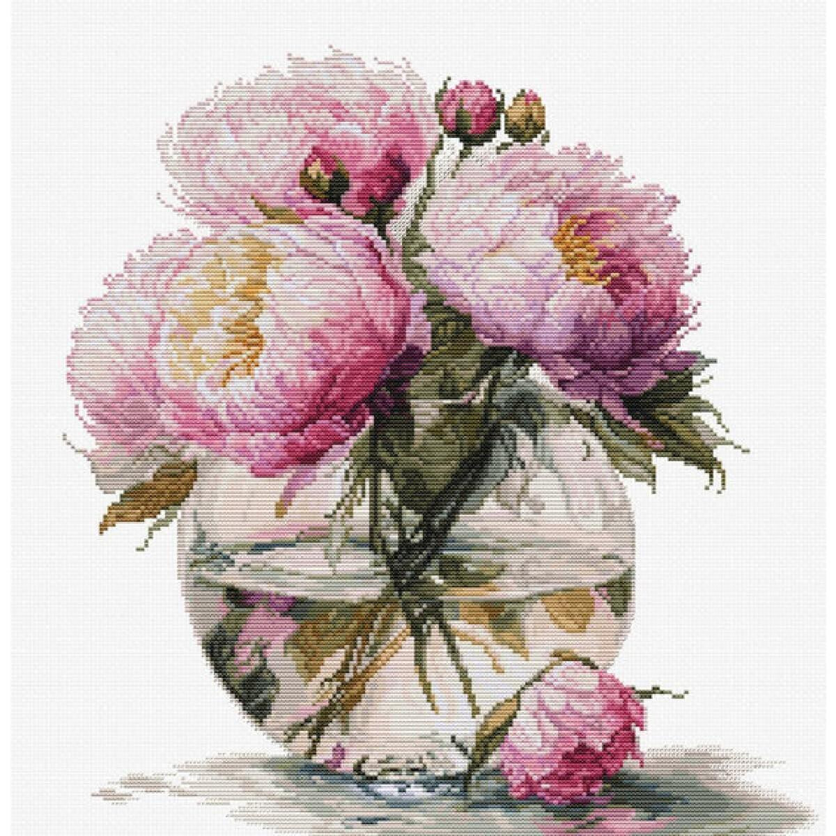 A round glass vase filled with water contains a bouquet...