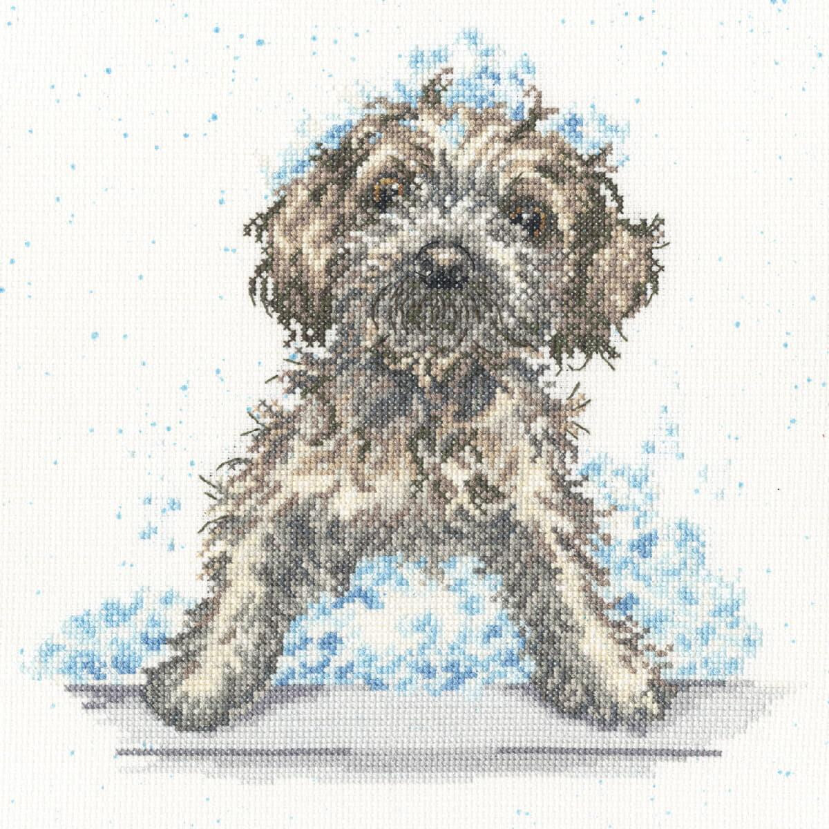 A detailed embroidery pack artwork of a small, fluffy dog...