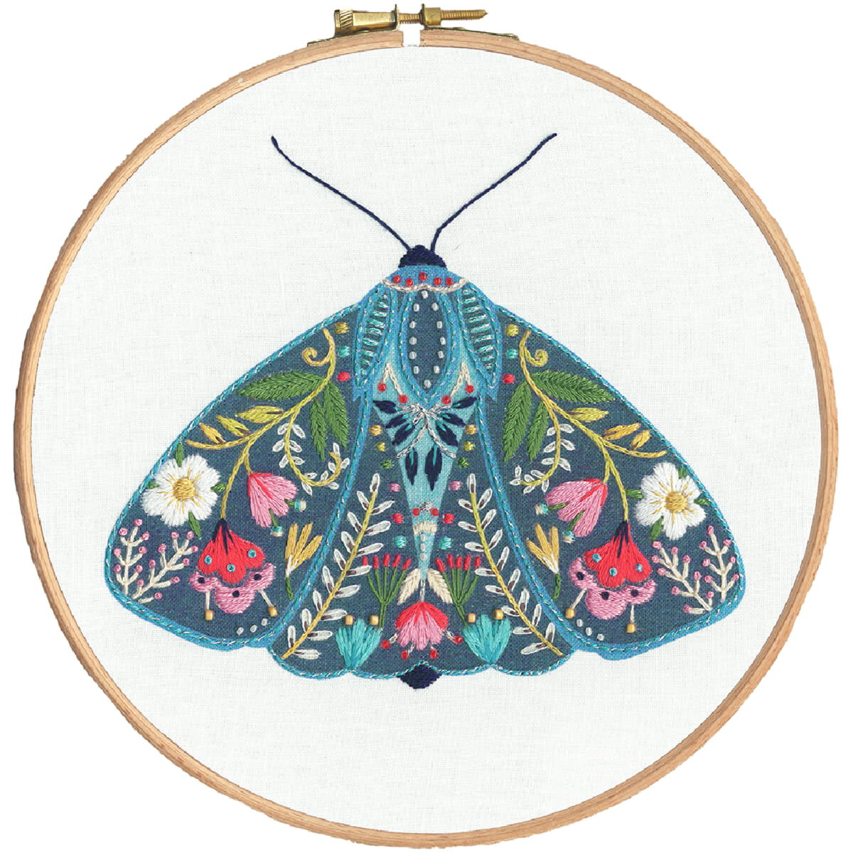 Embroidery of a colorful moth, framed in a wooden...