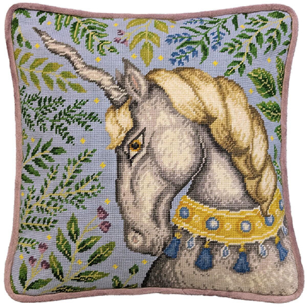 An embroidery pack from Bothy Threads, decorated with a detailed needlepoint embroidery image featuring a majestic unicorn. The unicorn has a long spiral horn, a golden braided mane and wears an ornate collar with blue tassels. The background is blue with green leaf patterns and a touch of yellow and purple detailing.