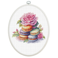 Luca-s embroidery pack with cross stitch design featuring a stack of colorful macarons decorated with pink, purple, orange and green shells, topped and surrounded by a blooming pink rose and rosebuds. The white fabric background complements the bright colors and shows careful detail.