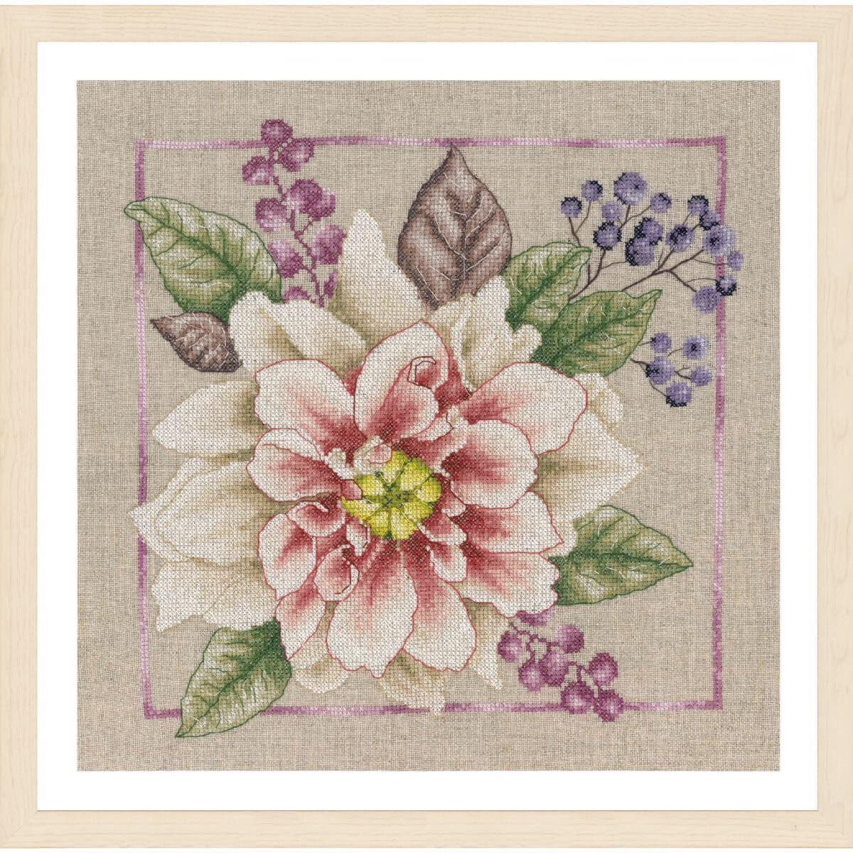 Cross stitch floral artwork featuring a large pink and...