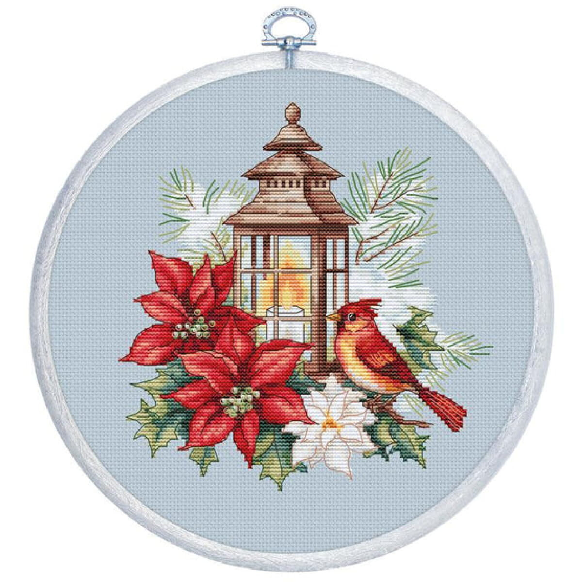A cross-stitch pattern in a round frame shows a brown...