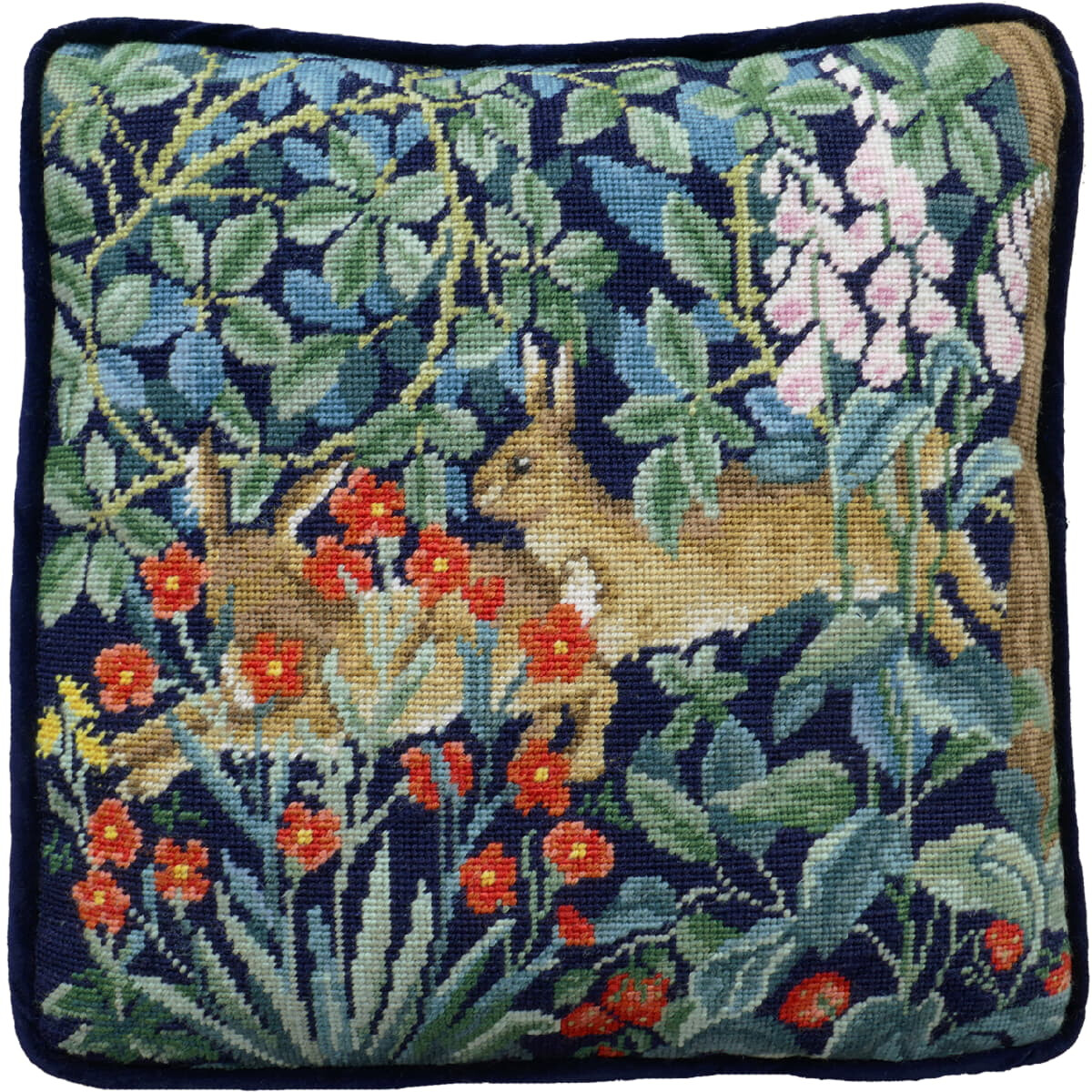 A square embroidery cushion with an elaborate forest...