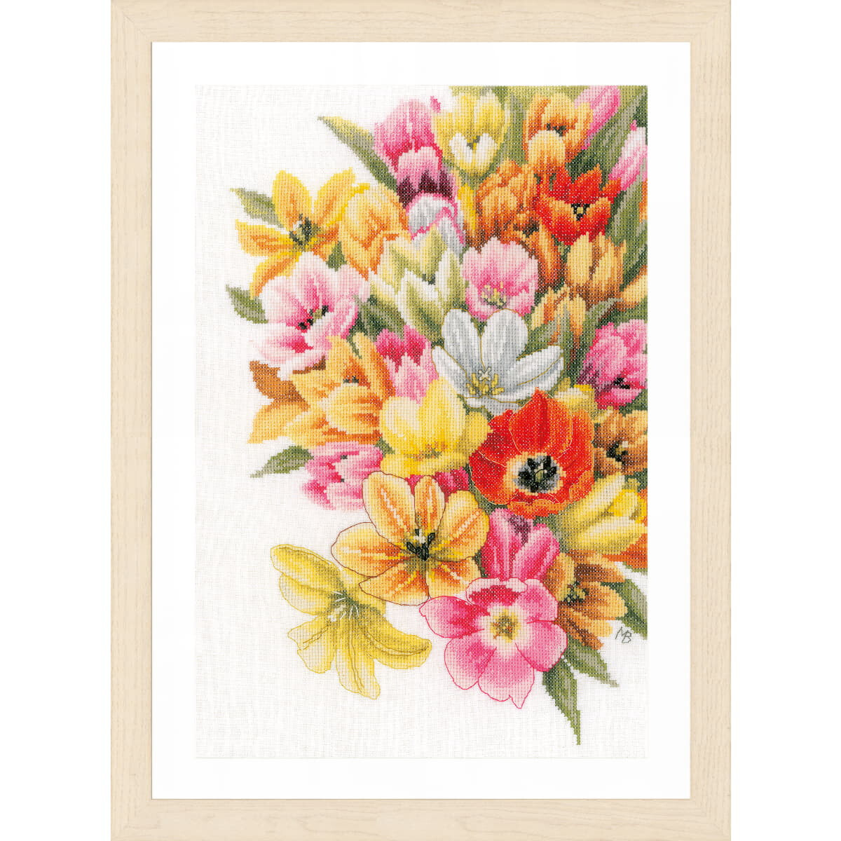 A framed embroidery showing a colorful bouquet of...