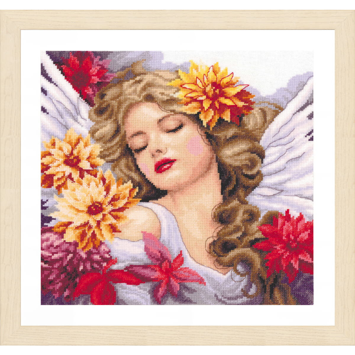 A framed embroidered picture shows a calm angel with...