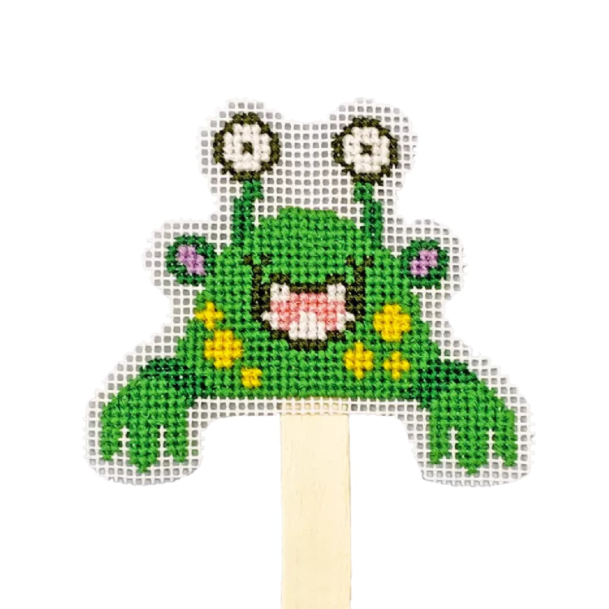 A cross-stitched frog puppet on a stick, or embroidery...