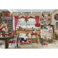 A cozy kitchen is festively decorated for Christmas. A cat is sitting on a wooden chair and a dog is taking a nap on a red cushion. Garlands, red ribbons and poinsettias adorn the window. A Noel sign, bunting and even a Christmas embroidery pack from Luca-s give the room a warm, Christmassy atmosphere.