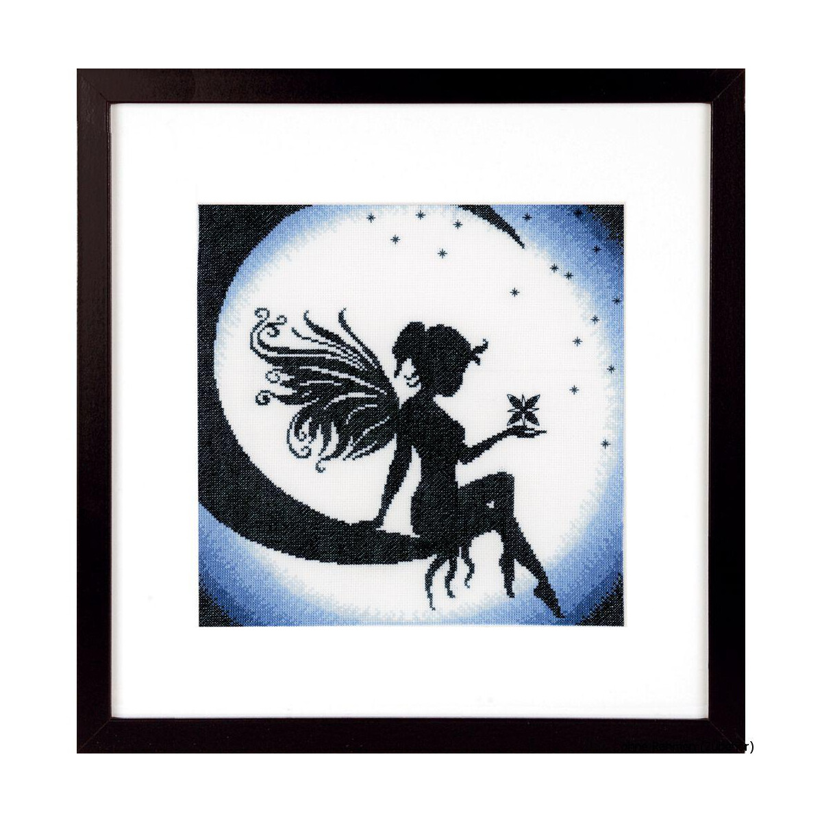 A framed work of art showing a fairy in silhouette with...