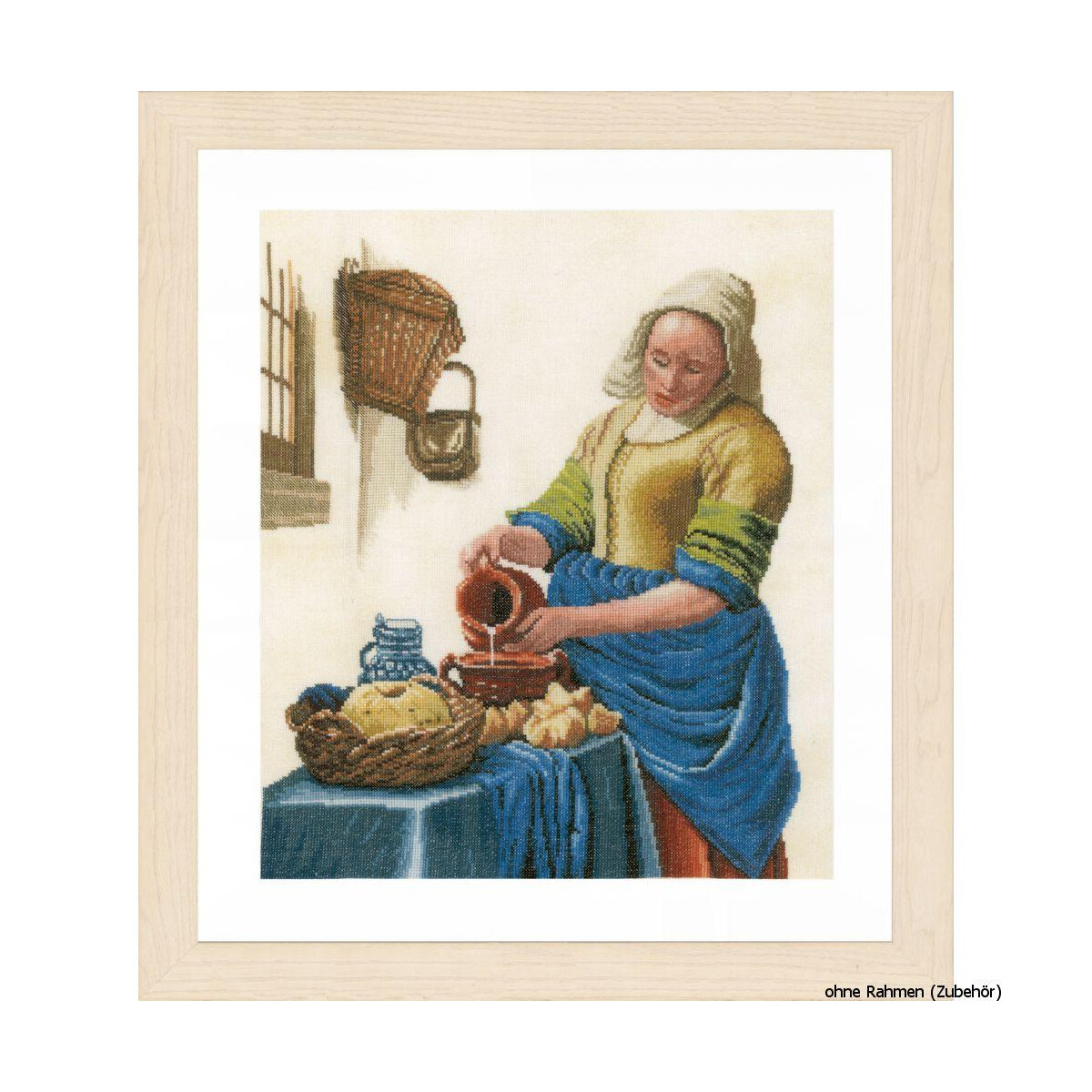 A Lanarte embroidery pack shows a woman pouring liquid...