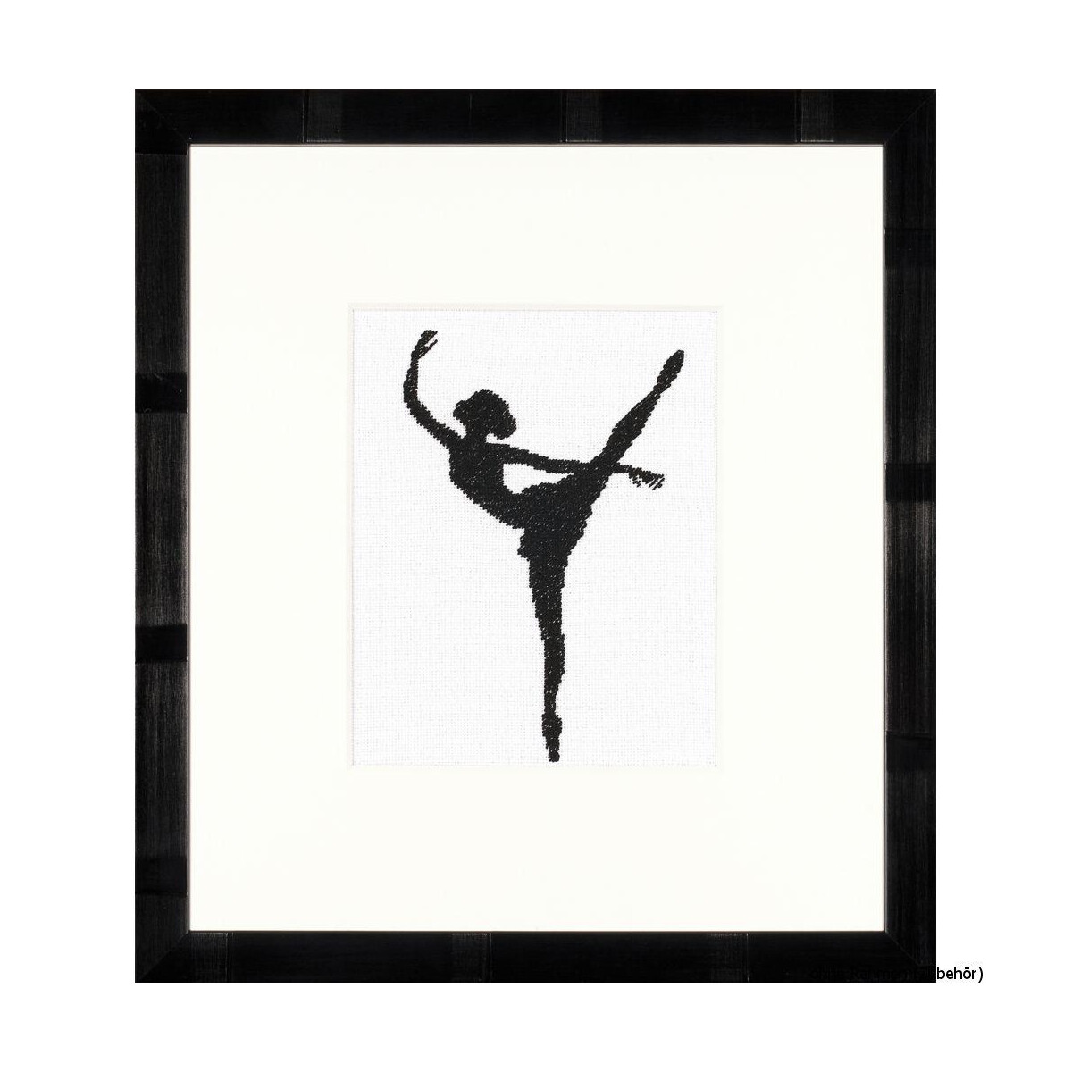 Framed artwork showing the black silhouette of a ballet...